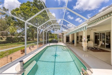 SPACIOUS OPEN VIEWS OF POOL, YARD, TREES, GOLF COURSE and LAKE on Pelican Pointe Golf and Country Club in Florida - for sale on GolfHomes.com, golf home, golf lot