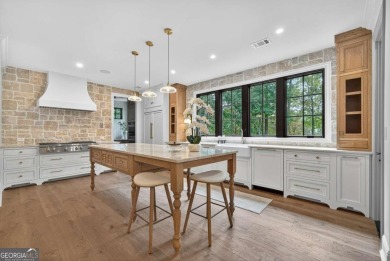 Welcome to your dream home, where timeless European charm meets on Reynolds Lake Oconee - The Landing in Georgia - for sale on GolfHomes.com, golf home, golf lot