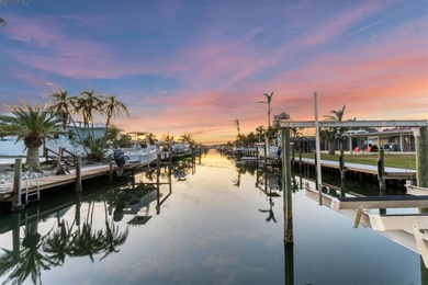Storm-ready luxury meets waterfront serenity -- live confidently on Key Royale Club in Florida - for sale on GolfHomes.com, golf home, golf lot