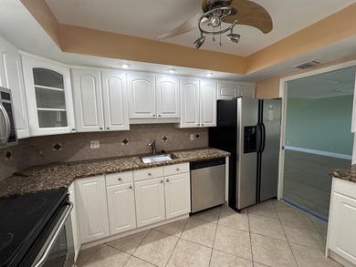 Enjoy breathtaking views of the golf course from your screened on Palm-Aire Country Club and Resort - The Oaks in Florida - for sale on GolfHomes.com, golf home, golf lot