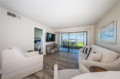 Tastefully remodeled in 2022 with high-end finishes, this ground on Isla Del Sol Yacht and Country Club in Florida - for sale on GolfHomes.com, golf home, golf lot