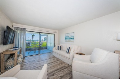 Tastefully remodeled in 2022 with high-end finishes, this ground on Isla Del Sol Yacht and Country Club in Florida - for sale on GolfHomes.com, golf home, golf lot