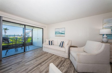 Tastefully remodeled in 2022 with high-end finishes, this ground on Isla Del Sol Yacht and Country Club in Florida - for sale on GolfHomes.com, golf home, golf lot