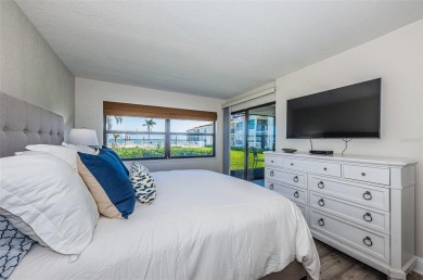 Tastefully remodeled in 2022 with high-end finishes, this ground on Isla Del Sol Yacht and Country Club in Florida - for sale on GolfHomes.com, golf home, golf lot