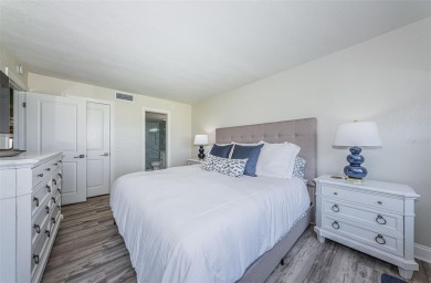 Tastefully remodeled in 2022 with high-end finishes, this ground on Isla Del Sol Yacht and Country Club in Florida - for sale on GolfHomes.com, golf home, golf lot