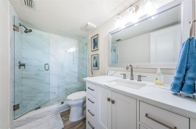 Tastefully remodeled in 2022 with high-end finishes, this ground on Isla Del Sol Yacht and Country Club in Florida - for sale on GolfHomes.com, golf home, golf lot