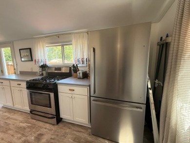 SEAS THE BAY! Coastal beach cottage, originally built in 1920 on Bay Creek Golf Club in Virginia - for sale on GolfHomes.com, golf home, golf lot