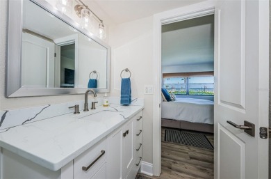 Tastefully remodeled in 2022 with high-end finishes, this ground on Isla Del Sol Yacht and Country Club in Florida - for sale on GolfHomes.com, golf home, golf lot