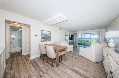 Tastefully remodeled in 2022 with high-end finishes, this ground on Isla Del Sol Yacht and Country Club in Florida - for sale on GolfHomes.com, golf home, golf lot
