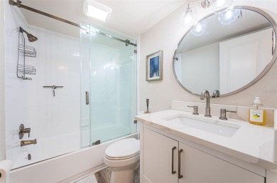 Tastefully remodeled in 2022 with high-end finishes, this ground on Isla Del Sol Yacht and Country Club in Florida - for sale on GolfHomes.com, golf home, golf lot