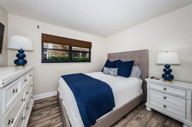 Tastefully remodeled in 2022 with high-end finishes, this ground on Isla Del Sol Yacht and Country Club in Florida - for sale on GolfHomes.com, golf home, golf lot
