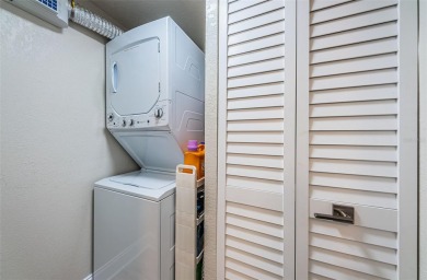Tastefully remodeled in 2022 with high-end finishes, this ground on Isla Del Sol Yacht and Country Club in Florida - for sale on GolfHomes.com, golf home, golf lot
