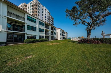 Tastefully remodeled in 2022 with high-end finishes, this ground on Isla Del Sol Yacht and Country Club in Florida - for sale on GolfHomes.com, golf home, golf lot
