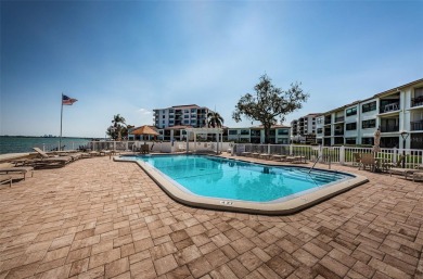 Tastefully remodeled in 2022 with high-end finishes, this ground on Isla Del Sol Yacht and Country Club in Florida - for sale on GolfHomes.com, golf home, golf lot