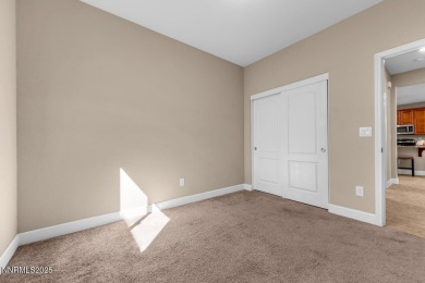 Enjoy breathtaking mountain and valley views from this on Somersett Country Club in Nevada - for sale on GolfHomes.com, golf home, golf lot