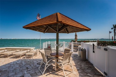 Tastefully remodeled in 2022 with high-end finishes, this ground on Isla Del Sol Yacht and Country Club in Florida - for sale on GolfHomes.com, golf home, golf lot