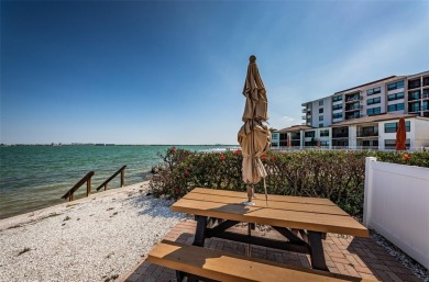 Tastefully remodeled in 2022 with high-end finishes, this ground on Isla Del Sol Yacht and Country Club in Florida - for sale on GolfHomes.com, golf home, golf lot