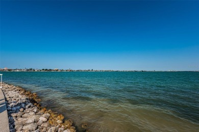 Tastefully remodeled in 2022 with high-end finishes, this ground on Isla Del Sol Yacht and Country Club in Florida - for sale on GolfHomes.com, golf home, golf lot