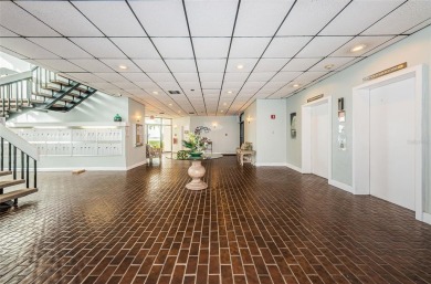 Tastefully remodeled in 2022 with high-end finishes, this ground on Isla Del Sol Yacht and Country Club in Florida - for sale on GolfHomes.com, golf home, golf lot