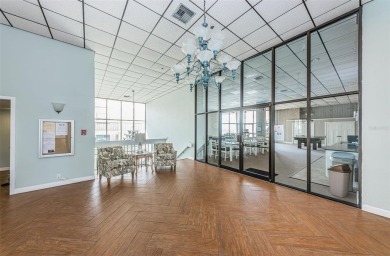 Tastefully remodeled in 2022 with high-end finishes, this ground on Isla Del Sol Yacht and Country Club in Florida - for sale on GolfHomes.com, golf home, golf lot