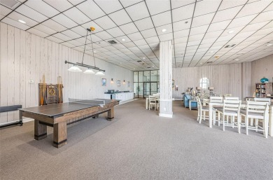 Tastefully remodeled in 2022 with high-end finishes, this ground on Isla Del Sol Yacht and Country Club in Florida - for sale on GolfHomes.com, golf home, golf lot