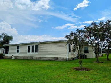 THIS IS A 2005 PALM HARBOR TRIPLE WIDE WITH OVER 1400 FEET OF on Southport Springs Golf Club in Florida - for sale on GolfHomes.com, golf home, golf lot