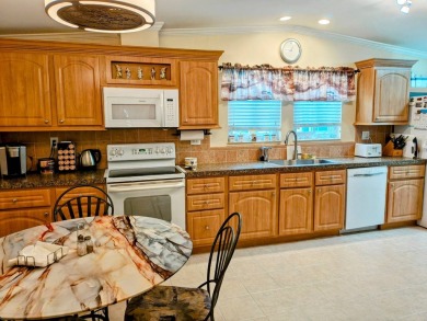 THIS IS A 2005 PALM HARBOR TRIPLE WIDE WITH OVER 1400 FEET OF on Southport Springs Golf Club in Florida - for sale on GolfHomes.com, golf home, golf lot