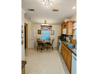 THIS IS A 2005 PALM HARBOR TRIPLE WIDE WITH OVER 1400 FEET OF on Southport Springs Golf Club in Florida - for sale on GolfHomes.com, golf home, golf lot