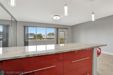 BEST VALUE IN CAMBRIDGE FOR ONE A BEDROOM! IMPACT WINDOWS FRONT on Hillsboro Pines Golf in Florida - for sale on GolfHomes.com, golf home, golf lot