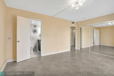 BEST VALUE IN CAMBRIDGE FOR ONE A BEDROOM! IMPACT WINDOWS FRONT on Hillsboro Pines Golf in Florida - for sale on GolfHomes.com, golf home, golf lot