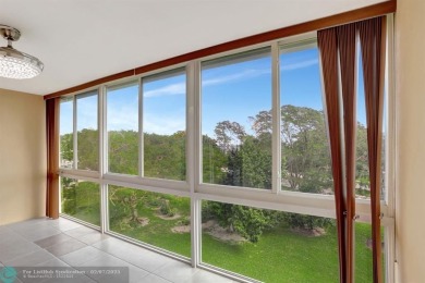 BEST VALUE IN CAMBRIDGE FOR ONE A BEDROOM! IMPACT WINDOWS FRONT on Hillsboro Pines Golf in Florida - for sale on GolfHomes.com, golf home, golf lot