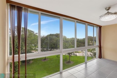 BEST VALUE IN CAMBRIDGE FOR ONE A BEDROOM! IMPACT WINDOWS FRONT on Hillsboro Pines Golf in Florida - for sale on GolfHomes.com, golf home, golf lot