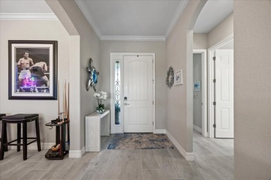 Discover the perfect blend of comfort, elegance, and Florida on Ritz-Carlton Members Golf Club in Florida - for sale on GolfHomes.com, golf home, golf lot