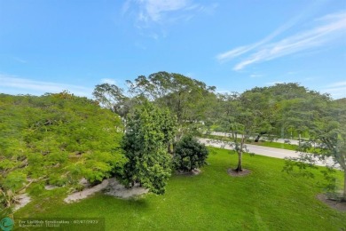 BEST VALUE IN CAMBRIDGE FOR ONE A BEDROOM! IMPACT WINDOWS FRONT on Hillsboro Pines Golf in Florida - for sale on GolfHomes.com, golf home, golf lot