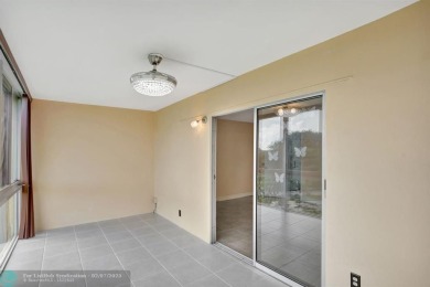 BEST VALUE IN CAMBRIDGE FOR ONE A BEDROOM! IMPACT WINDOWS FRONT on Hillsboro Pines Golf in Florida - for sale on GolfHomes.com, golf home, golf lot