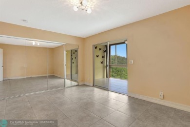 BEST VALUE IN CAMBRIDGE FOR ONE A BEDROOM! IMPACT WINDOWS FRONT on Hillsboro Pines Golf in Florida - for sale on GolfHomes.com, golf home, golf lot