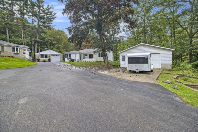Hamlin Township - This 3-bedroom, 2-bath home sits on 1.5 wooded on Lincoln Hills Golf Club in Michigan - for sale on GolfHomes.com, golf home, golf lot
