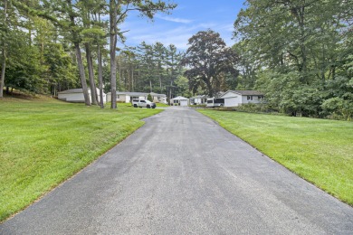 Hamlin Township - This 3-bedroom, 2-bath home sits on 1.5 wooded on Lincoln Hills Golf Club in Michigan - for sale on GolfHomes.com, golf home, golf lot