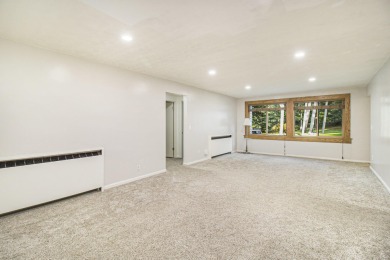 Hamlin Township - This 3-bedroom, 2-bath home sits on 1.5 wooded on Lincoln Hills Golf Club in Michigan - for sale on GolfHomes.com, golf home, golf lot
