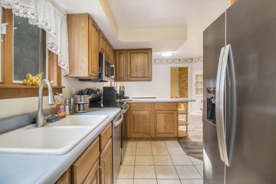Hamlin Township - This 3-bedroom, 2-bath home sits on 1.5 wooded on Lincoln Hills Golf Club in Michigan - for sale on GolfHomes.com, golf home, golf lot