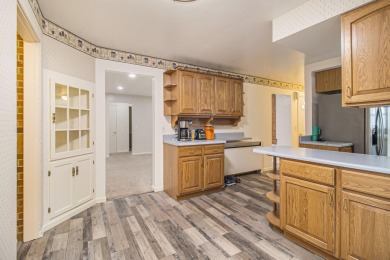 Hamlin Township - This 3-bedroom, 2-bath home sits on 1.5 wooded on Lincoln Hills Golf Club in Michigan - for sale on GolfHomes.com, golf home, golf lot