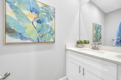 As you arrive at 304 Windrow Way, the corner-lot setting and on Origins Golf Club in Florida - for sale on GolfHomes.com, golf home, golf lot