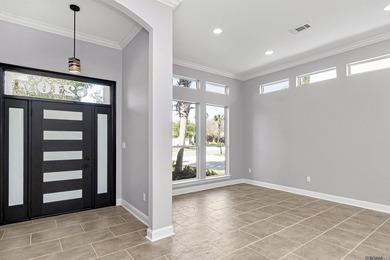 Discover 6210 Royal Palm Ct -- a fully remodeled 5-bedroom on Pelican Point Golf Club in Louisiana - for sale on GolfHomes.com, golf home, golf lot