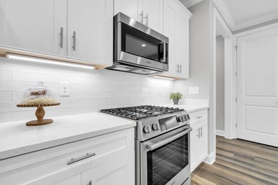 As you arrive at 304 Windrow Way, the corner-lot setting and on Origins Golf Club in Florida - for sale on GolfHomes.com, golf home, golf lot