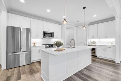 As you arrive at 304 Windrow Way, the corner-lot setting and on Origins Golf Club in Florida - for sale on GolfHomes.com, golf home, golf lot