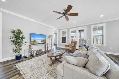 As you arrive at 304 Windrow Way, the corner-lot setting and on Origins Golf Club in Florida - for sale on GolfHomes.com, golf home, golf lot