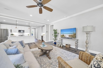 As you arrive at 304 Windrow Way, the corner-lot setting and on Origins Golf Club in Florida - for sale on GolfHomes.com, golf home, golf lot