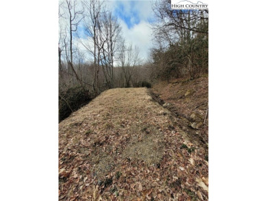 Buildable lot on an unimproved town road.  Building a home will on Beech Mountain Club in North Carolina - for sale on GolfHomes.com, golf home, golf lot