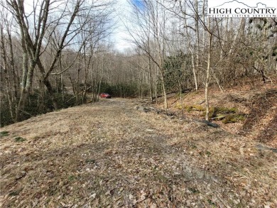 Buildable lot on an unimproved town road.  Building a home will on Beech Mountain Club in North Carolina - for sale on GolfHomes.com, golf home, golf lot