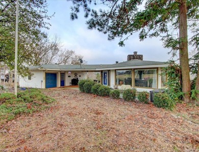 Not the typical 2-bedroom, 2-bath home, This architectural gem on Diamondhead Golf and Country Club in Arkansas - for sale on GolfHomes.com, golf home, golf lot